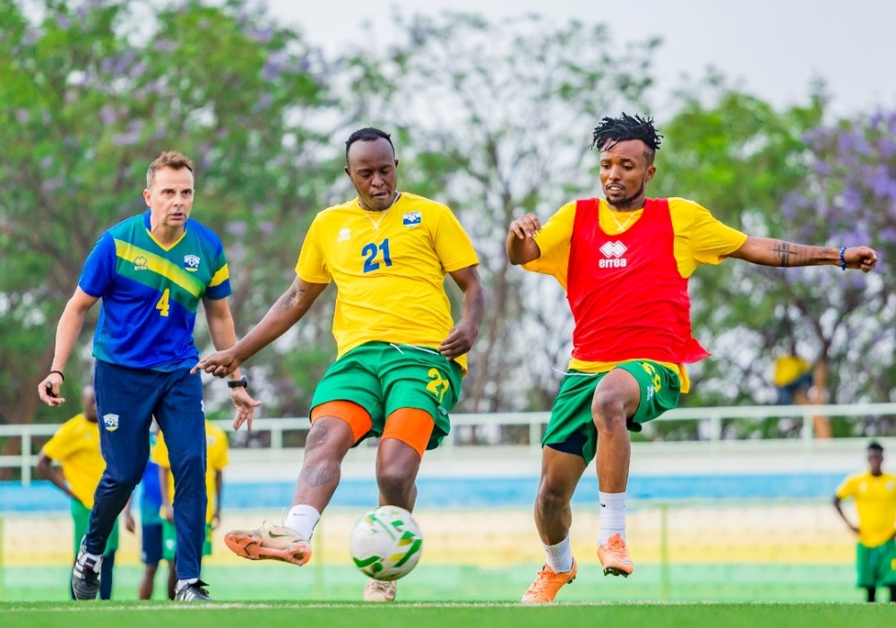 Rwanda&#039;s national football team head coach, Carlos Alòs inspects players during a training session at Kigali Stadium. Courtesy