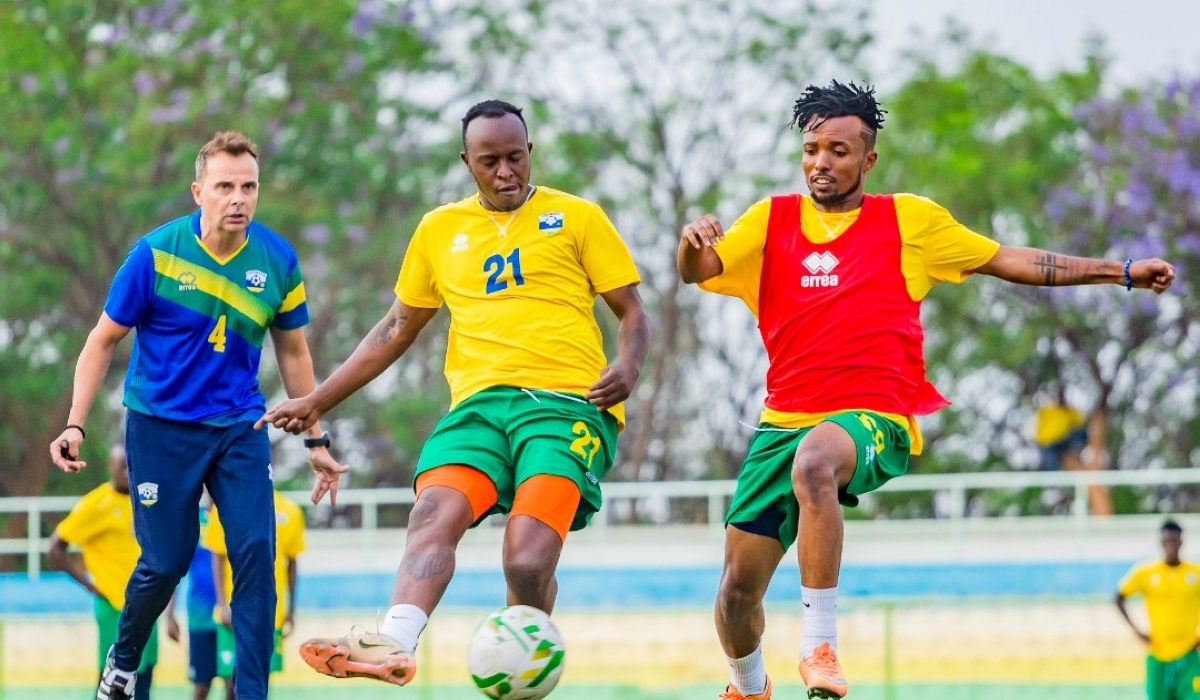 Rwanda&#039;s national football team head coach, Carlos Alòs inspects players during a training session at Kigali Stadium. Courtesy