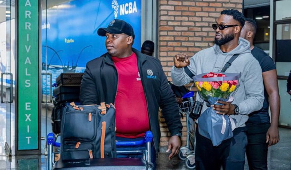 DJ Neptune (right) at Kigali International Airport on Wednesday. / Photo: Courtesy