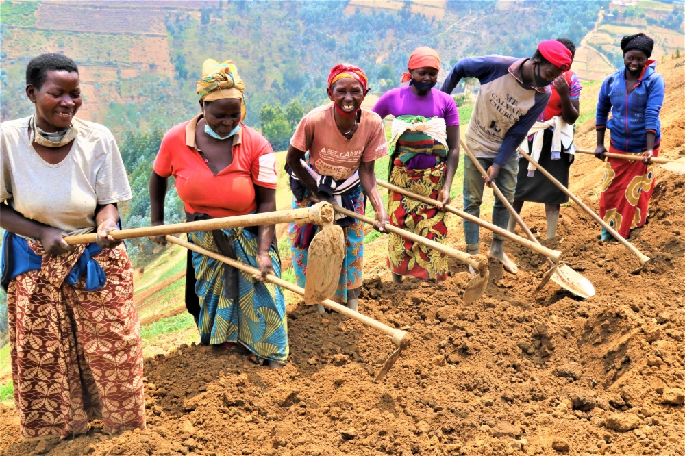 Community members construct terraces to fight erosion and turn soil fertile.