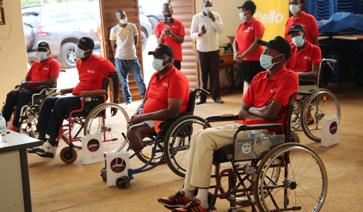 People with disability during an event to receive smart phones during a Connekt Rwanda campaign at Nyarugunga Sector. / Photo: Craish Bahizi