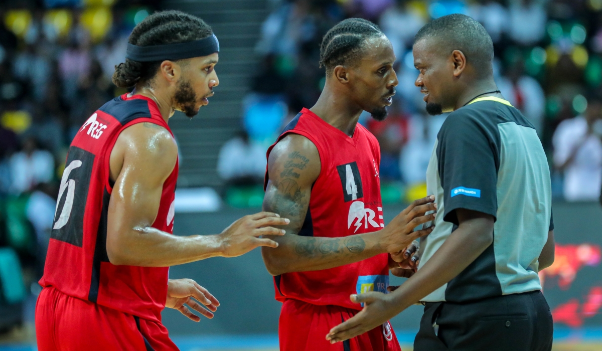 REG’s shooting guard Adonis and teammate Cleveland Thomas Jr confront the umpire during the final game of the play-offs on Sunday. The duo were instrumental as REG defeated Patriots 84-74. Photo: Dan Nsengiyumva.