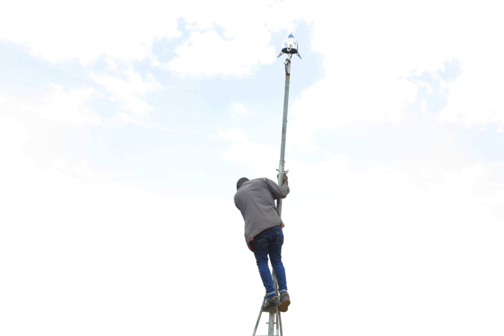 A technician installs one of many lightning conductors that are being installed in Rutsiro District on November 4. Photo: Courtesy.