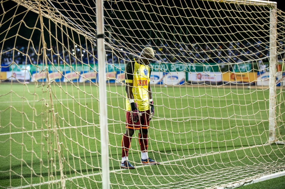 Rayon Sports goalkeeper Ramadan Kabwili looks so dejected as SC Kiyovu striker Bienvenue Mugenzi scored the second goal at Kigali Stadium. Photo Olivier Mugwiza