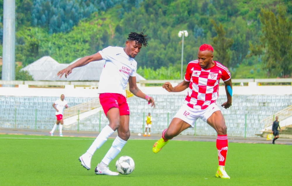 Etincelles FC forward Peter Agblevor  tries to go past Musanze defender during the match. The Rubavu based player netted the first goal as his team defeat Musanze FC  3-2  at the Umuganda Stadium in Gisenyi on Saturday, November 12. Courtesy