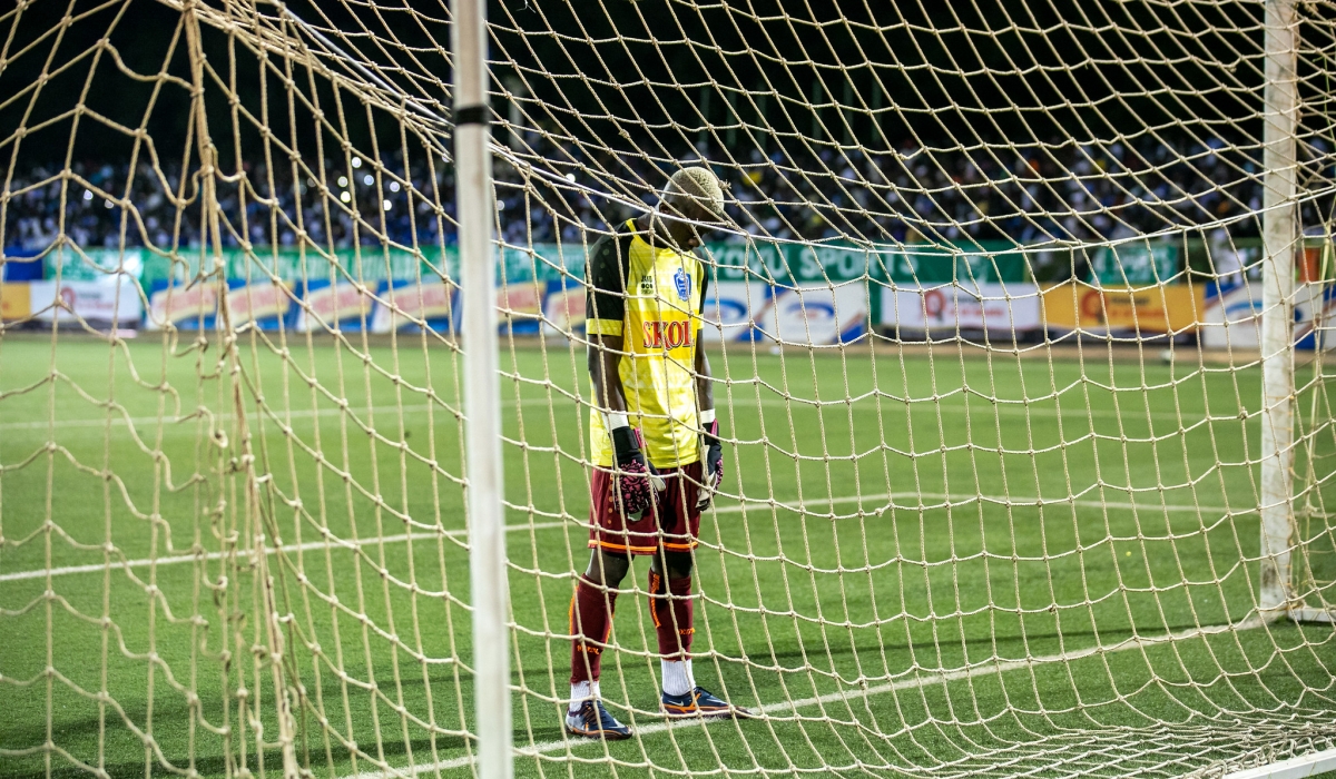 Rayon Sports goalkeeper Ramadan Kabwili looks so dejected as SC Kiyovu striker Bienvenue Mugenzi scored the second goal at Kigali Stadium. Photo Olivier Mugwiza