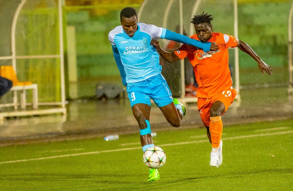 Police FC striker, Onesme Twizeyimana, wins the ball against an AS Kigali winger at Kigali stadium. Photo: Courtesy.