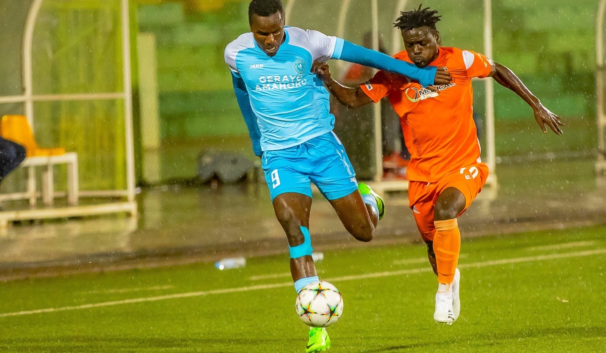 Police FC striker, Onesme Twizeyimana, wins the ball against an AS Kigali winger at Kigali stadium. Photo: Courtesy.