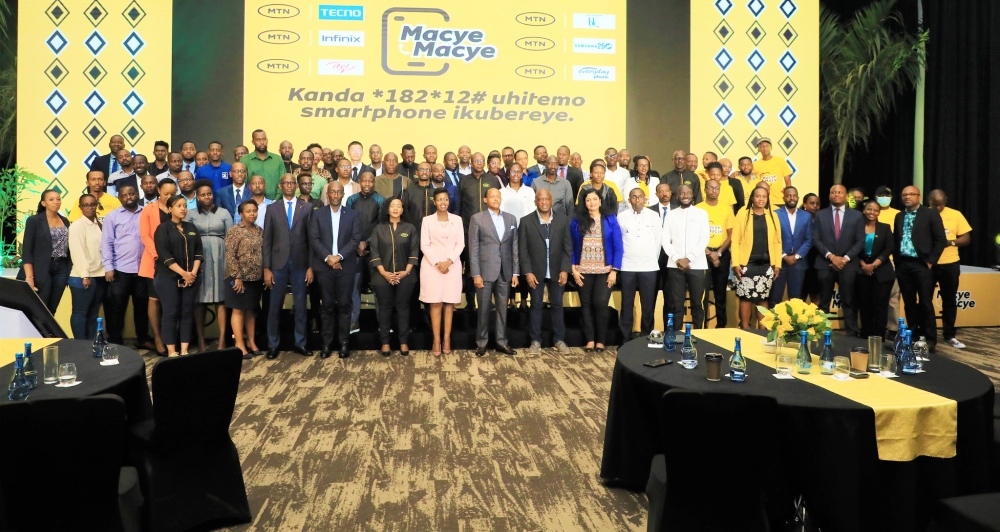 Delegates in a group photo during the launch of  a Device Financing Program dubbed ‘Macye Macye’ to enable customers to purchase smartphones and tablets by paying in installments.