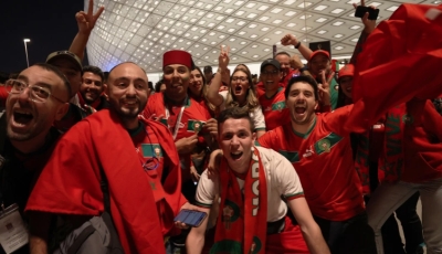 Morocco fans celebrate outside the stadium after advancing into the World Cup semi-finals on December 10, 2022 [Showkat Shafi/Al Jazeera]