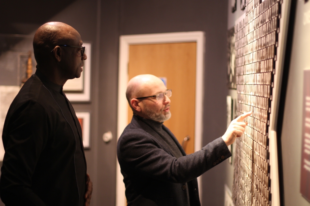  Aegis Trust Chief Executive Officer James Smith facilitates Rwanda’s High Commissioner to the United Kingdom, Johnson Busingye  during his tour of  the Holocaust Centre in Nottingham in UK. Aegis Trust collaborated with Rwandan authorities to establish the Kigali Genocide Memorial in 2004.  During his visit, Busingye lauded UK-based initiatives that are working to support survivors of the Genocide against the Tutsi, as well as contributing to peace-building in Rwanda. Photo Courtesy