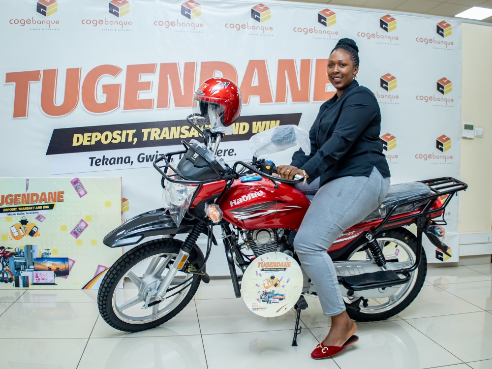 The winner of a motocycle during Tugendane na Cogebanque 2023 awarding event in Kigali on March 21. Photos by Dan Gatsinzi