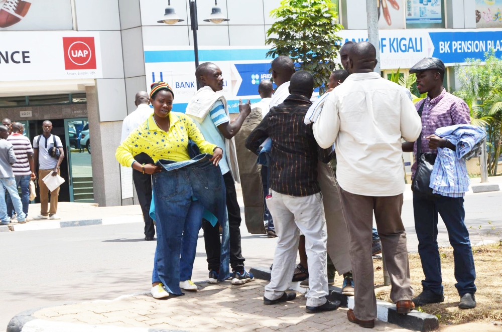 Some street vendors meet their clients in Kigali City&#039;s business district. Sam Ngendahimana