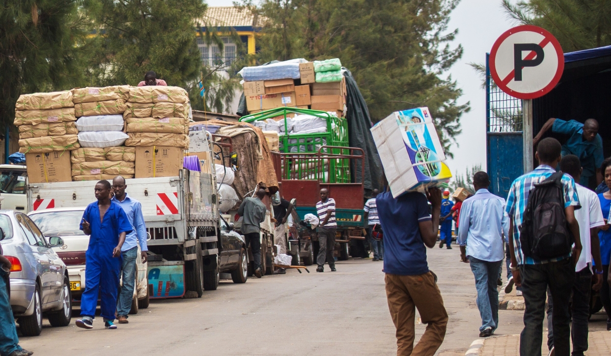 Workers load different commodities at Kigali City’s business district for upcountry supply. The new
tax reforms will reduce the tax burden on both business people and workers. Photo by Craish Bahizi