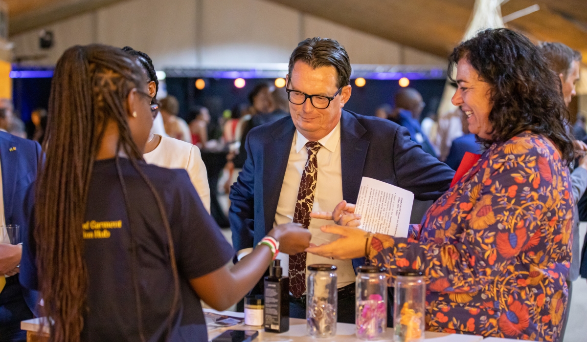 Visitors tour a booth at the event organised to showcase creativity of women entrepreneurs in Rwanda’s cultural and creative sectors. Photo: Willy Mucyo.