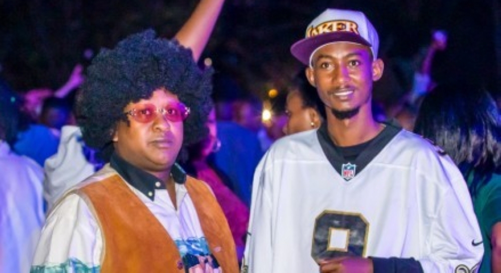 Music manager Alex Muyoboke and comedian Clapton Kibonge donning oldschool style during a past Oldies Music Festival event.