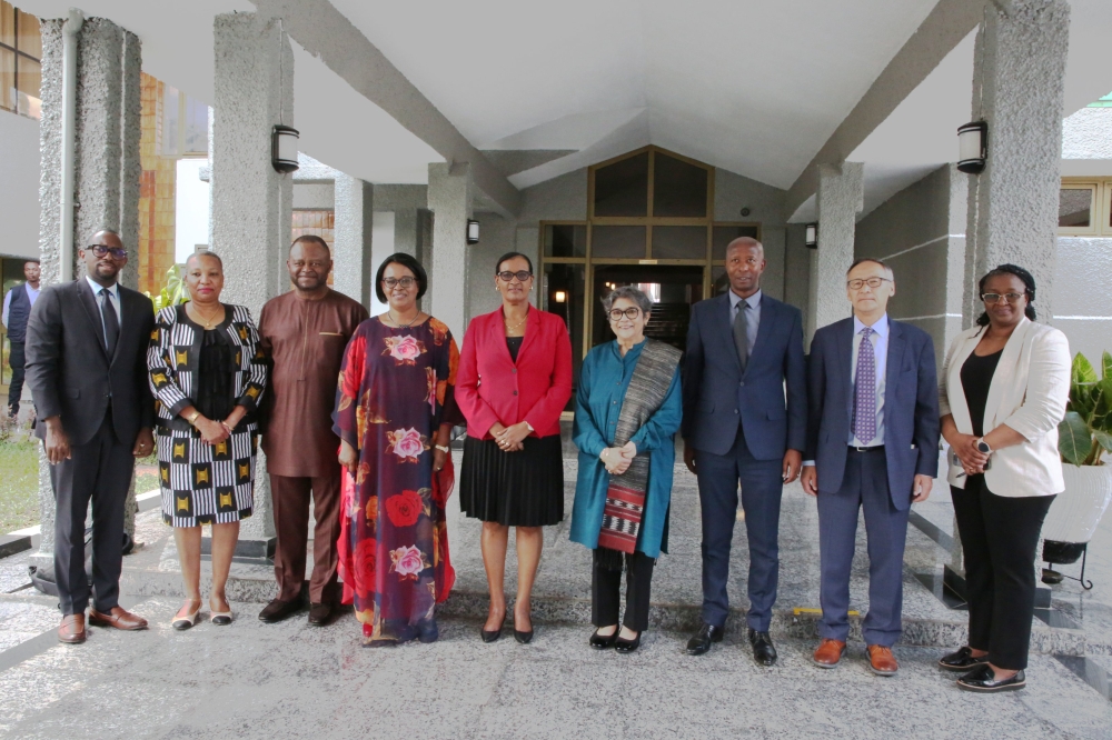 Speaker of the Chamber of Deputies, Donatille Mukabalisa (C), UN Under-Secretary-General and High Representative, Rabab Fatima (fourth right), and other officials pose for a group photo at Parliamentary Buildings in Kigali, on Friday, June 2, 2023 (courtesy).