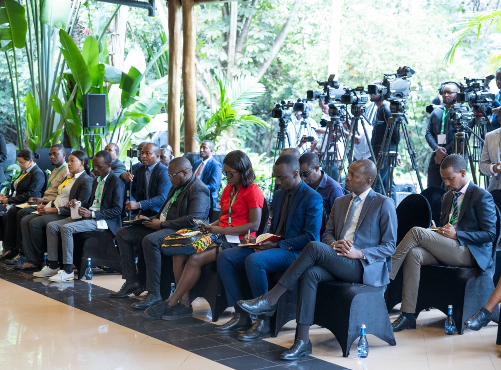 Journalists follow the two presidents during the news conference in Kigali on June 21 at Village Urugwiro
