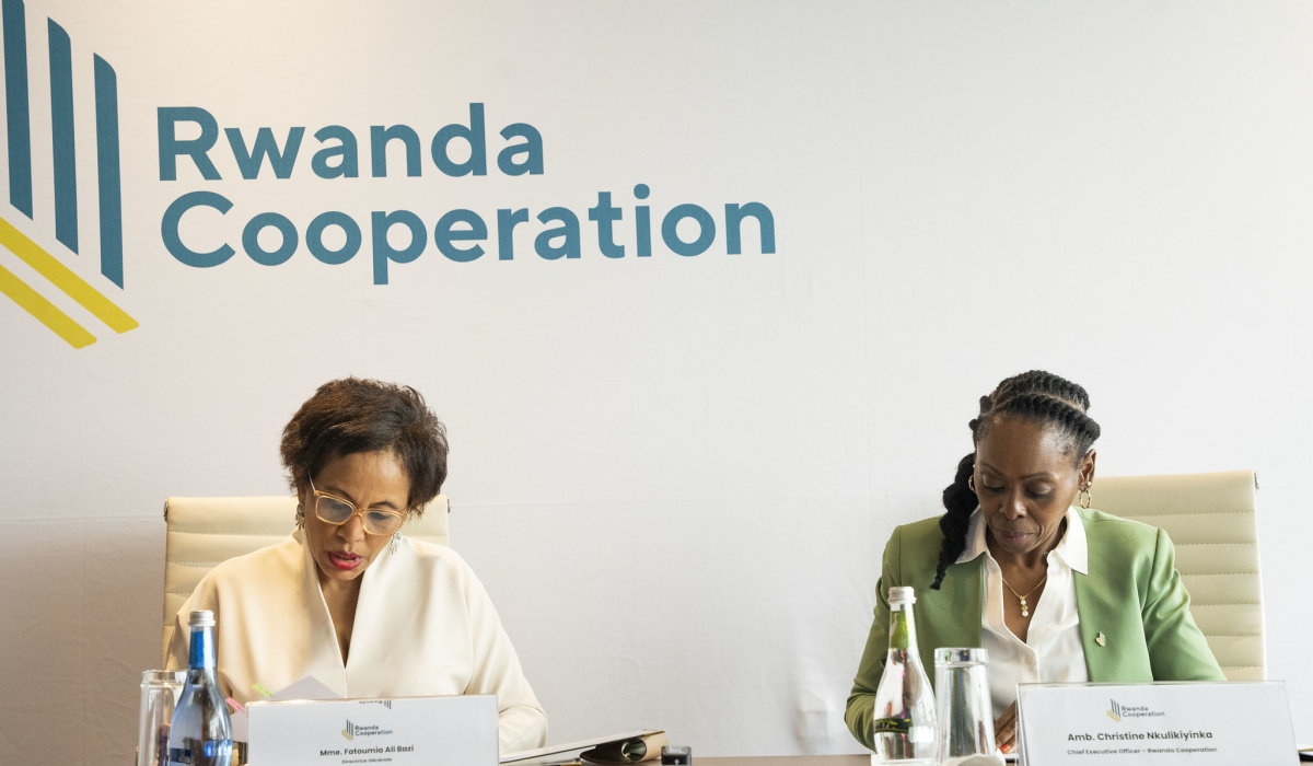 Rwanda Cooperation CEO, Ambassador Christine Nkulikiyinka, and ACCI’s Director General, Fatoumia Ali Bazi sign the agreement in Kigali on June 21. Photos by Emmanuel Dushimimana