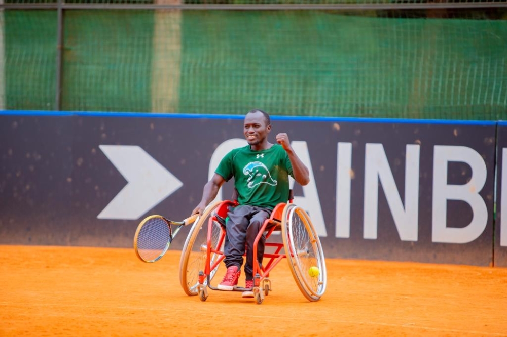 Champion Emmanuel Hakizimana celebrates after beating Ernest Ndayishimiye 2-1 sets in the final to win the Wheelchair tennis national tournament. Courtesy 