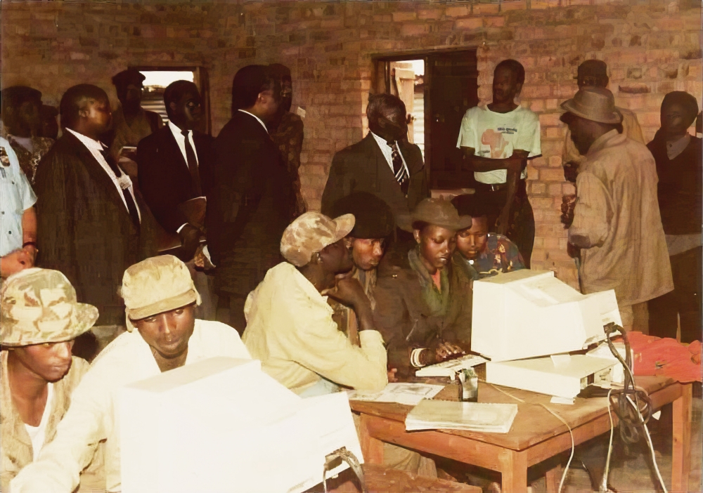 Some of the soldiers working on a computer. 