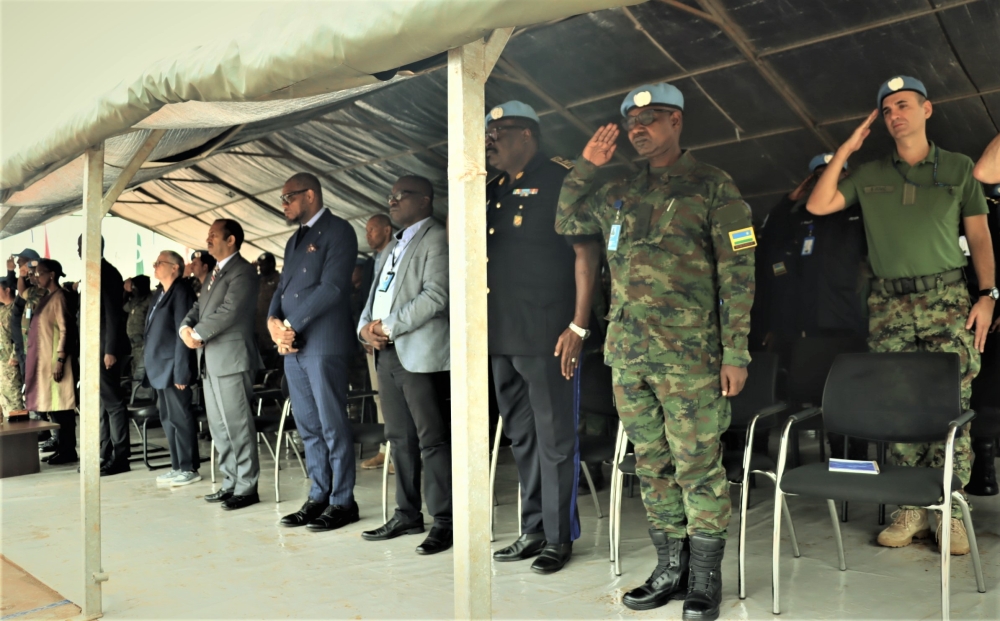 Mourners observe a moment of silence to pay respect to Rwanda&#039;s fallen peacekeeper on Saturday, July 15. Courtesy