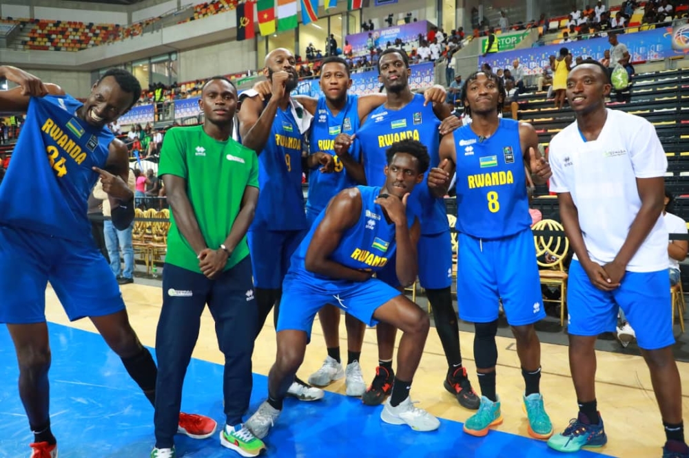 Players celebrate after winning  a third place following  a 82-73 win over  DR Congo at  2023 FIBA AfroCAN campaign   in Luanda. COURTESY