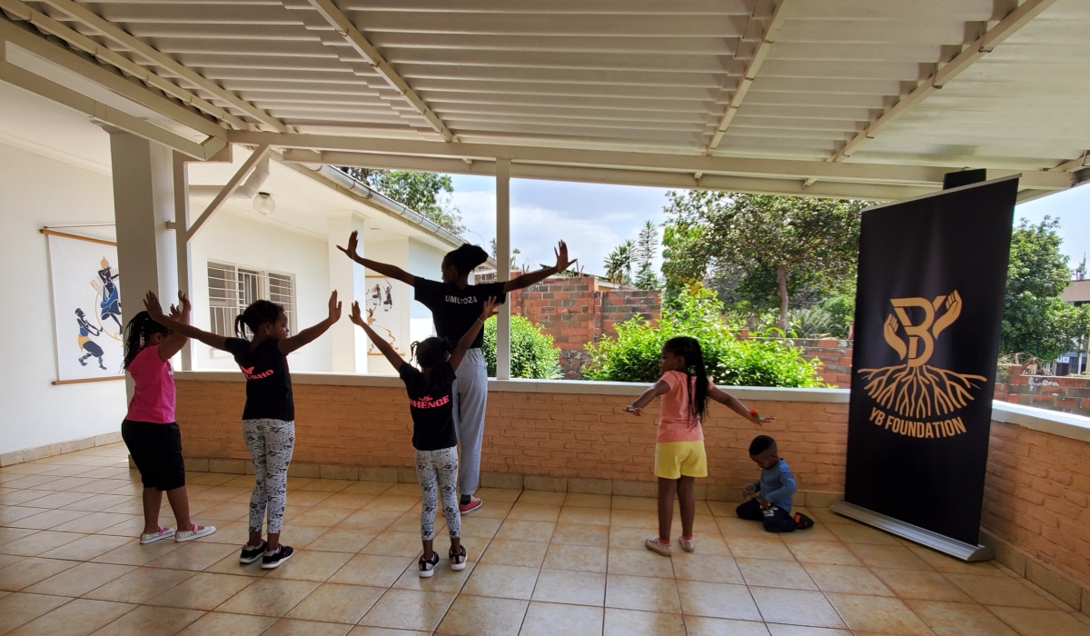 Children learning traditional dance moves at the academy