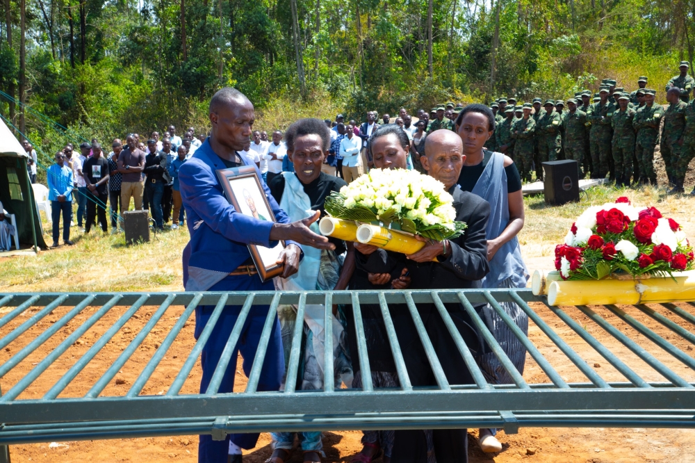 Family members of Late Sergeant Eustache Tabaro, lay wreaths during the burial at the Kanombe Military Cemetery on Tuesday, July 18. Courtesy