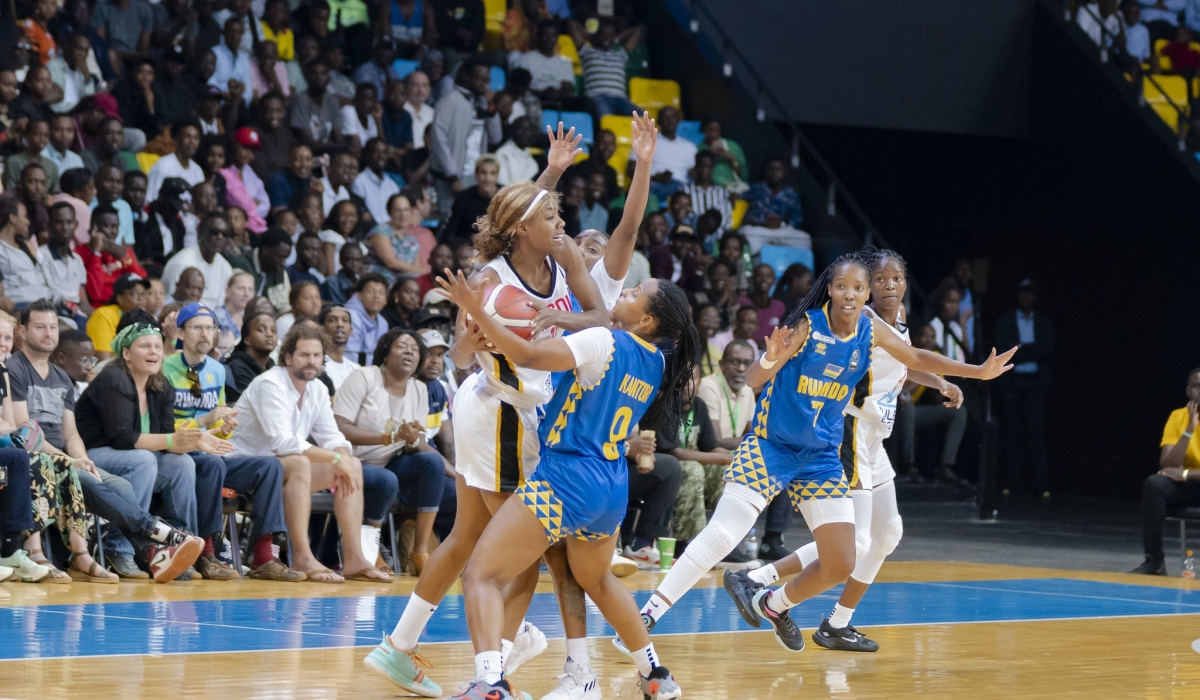 Angolan players battle for the ball with Rwandan defenders during the game at BK Arena on Sunday, July 30. All photos by Christianne Murengerantwari.