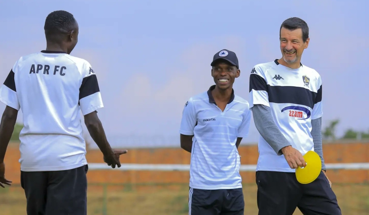 APR FC head coach Thierry Froger  chats with some staff during a training session ahead of Pyramids FC game on Friday, September 29, in Cairo. Courtesy