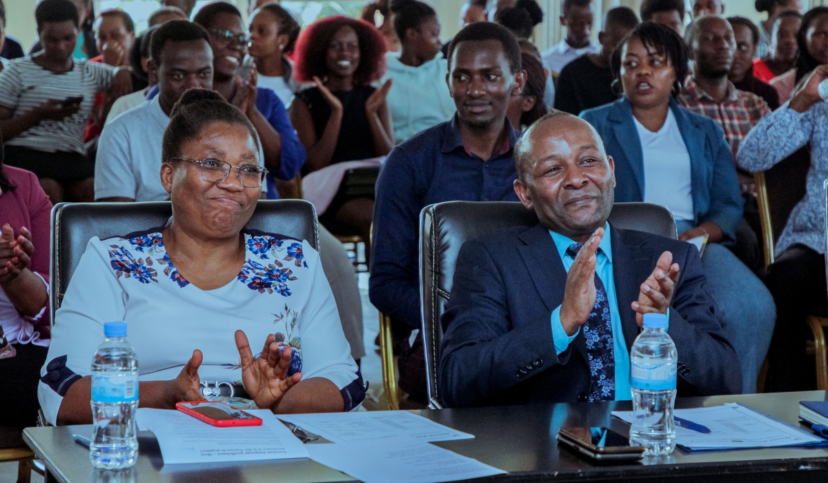 Dr. Nkechi Irechukwu, Deputy Vice-Chancellor Academics and Research Affairs including students applauding a speaker.