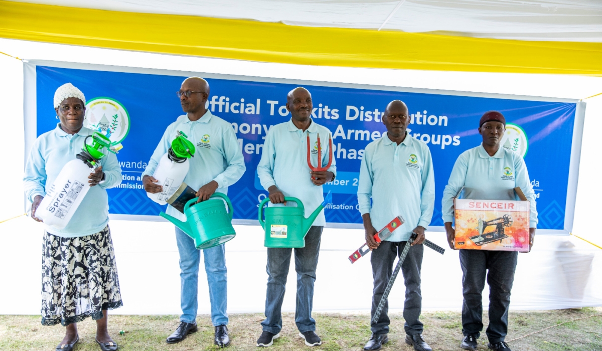 (L-R) Former FDLR militia members Xaverine Mukashyaka, ‘Major General’ Felicien Nsanzubukire, ‘Major General’ Anastase Munyaneza, former FDLR deputy president Straton Musoni, and ‘Staff Sergeant’ Anne Marie Nizane, were among the 100 ex-combatants and militia groups’ leaders equipped with toolkits on Thursday, September 28, 2023. Courtesy of RDRC  