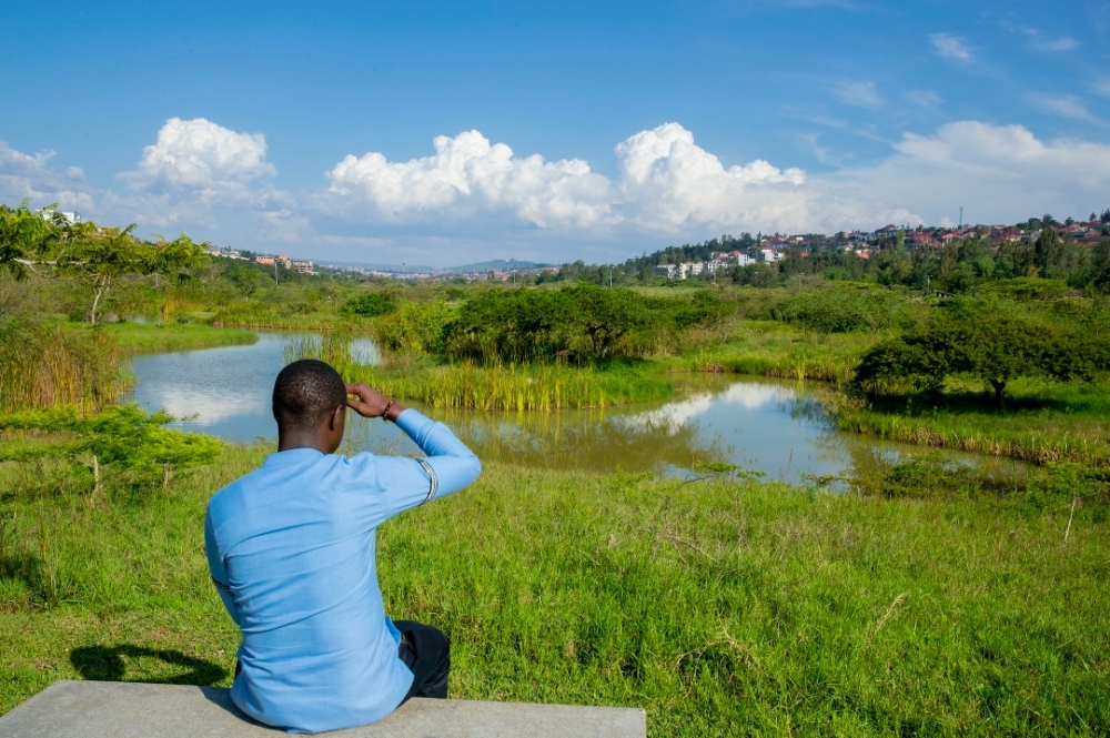 A resident sits at the newly revamped Nyandungu Wetland Ecotourism in Kigali