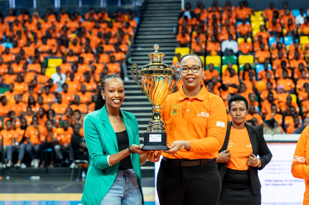 Minister Mimosa hand over the trophy to APR Volleyball captain during the closing ceremony of the 16 Days of Activism against Gender Based Violence event held at BK Arena on Sunday, December 10.