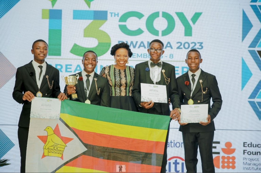 JA Africa CEO Simi Nwogugu (centre) poses for a picture with Team Zimbabwe which emerged as the winner of 2023 Company of the Yeat Competition. Courtesy (2) (1)