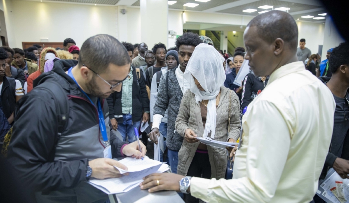 A group of refugees and asylum seekers evacuated from Libya on their arrival at Kigali International Airport in 2023. File