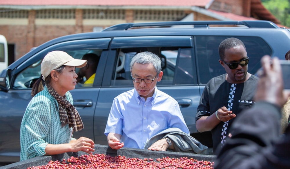 Amb Isao Fukushima (centre), Japan’s envoy to Rwanda, and Eric Ruganintwali, the then Quality Assurance and Regulatory Division Manager at NAEB, during a tour of coffee cooperatives supported under a Japan-funded project in Karongi, Kirehe and Ruhango Districts, in March 2023. Photo: Dan Kwizera