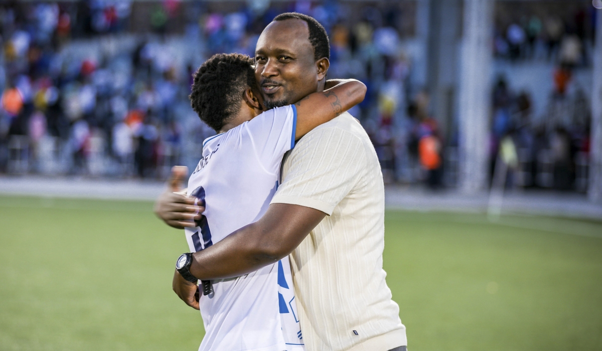 Police FC head coach Vincent Mashami and his player after the 2-1 match against Bugesera to win Peace Cup title at Kigali Pele Stadium. Photo by Craish Bahizi