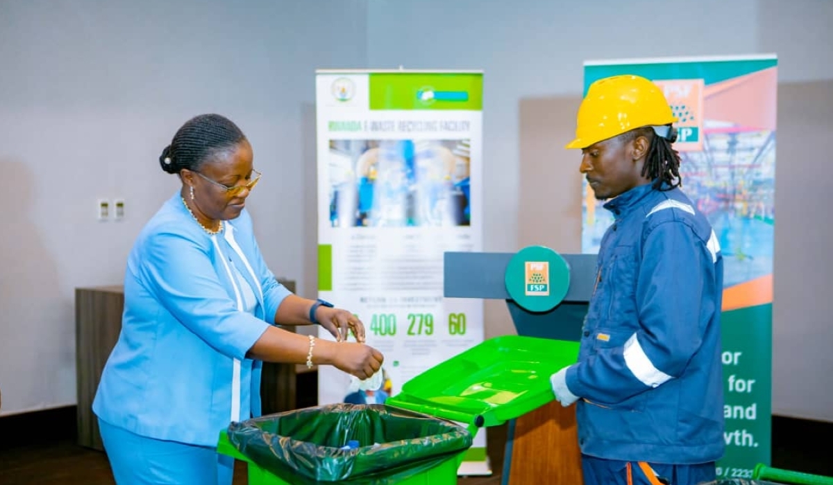 Minister of Environment, Jeanne d&#039;Arc Mujawamariya disposes plastic waste in a dustbin during the launch of a project to manage single use plastics in 2022. File photo 