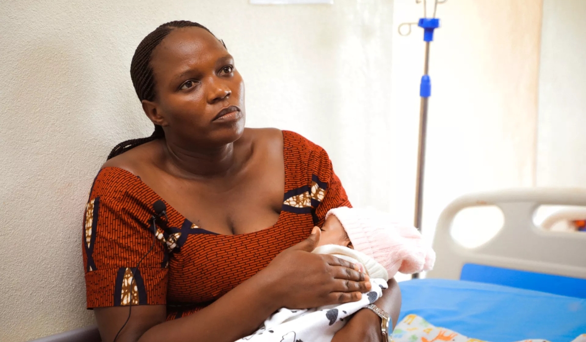 Rehema Kampire, a resident of Rubavu district in Western Rwanda, holds her daughter inside a hospital room. The baby was prematurely born at six months and a half, weighing just 1.3 kilograms. Photo by UNICEF Rwanda