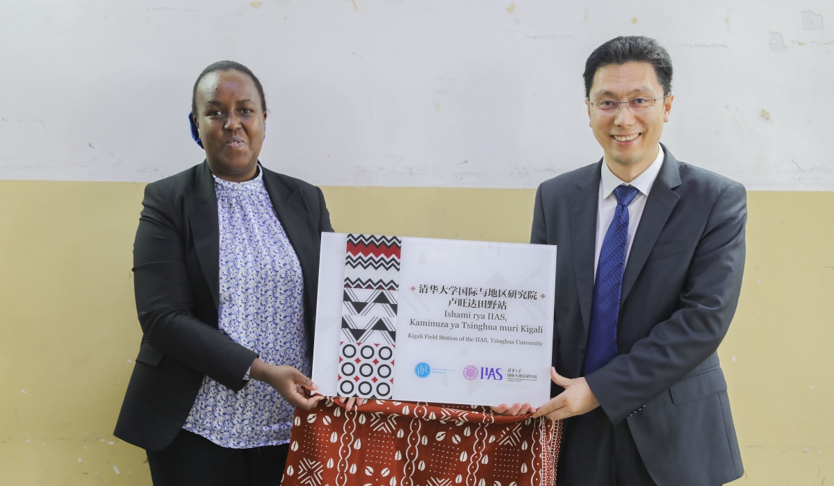 UR&#039;s Deputy Vice Chancellor for Finance, Francoise Tengera and Zhao Jinsong, Associate Director, IIAS, Tsinghua University, showcase the partners during the  launch of a field station for international and area studies at the University of Rwanda (UR) in Kigali on Thursday, May 9. All photos by Craish Bahizi