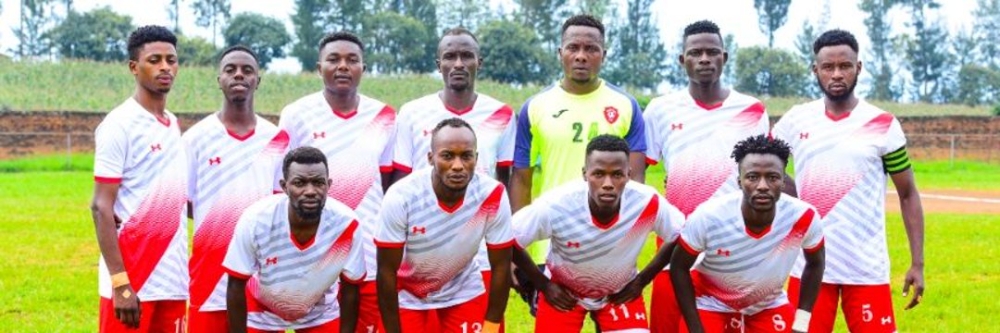 Espoir FC players pose for a photo before the game.