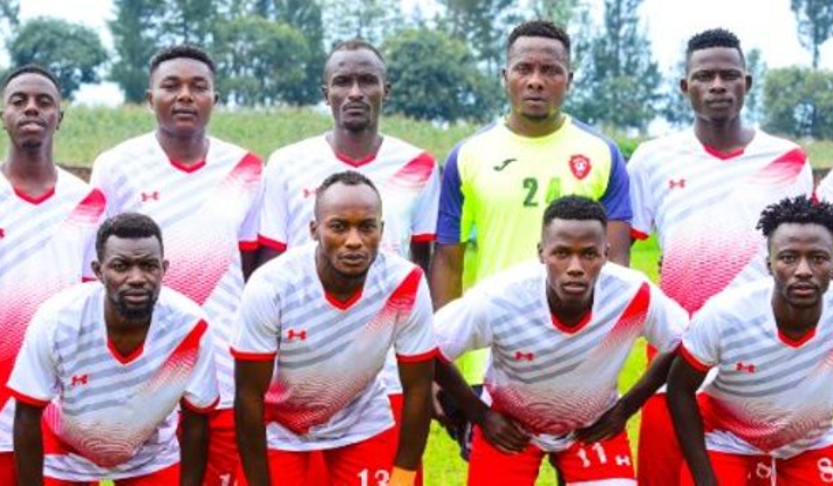 Espoir FC players pose for a photo before the game.