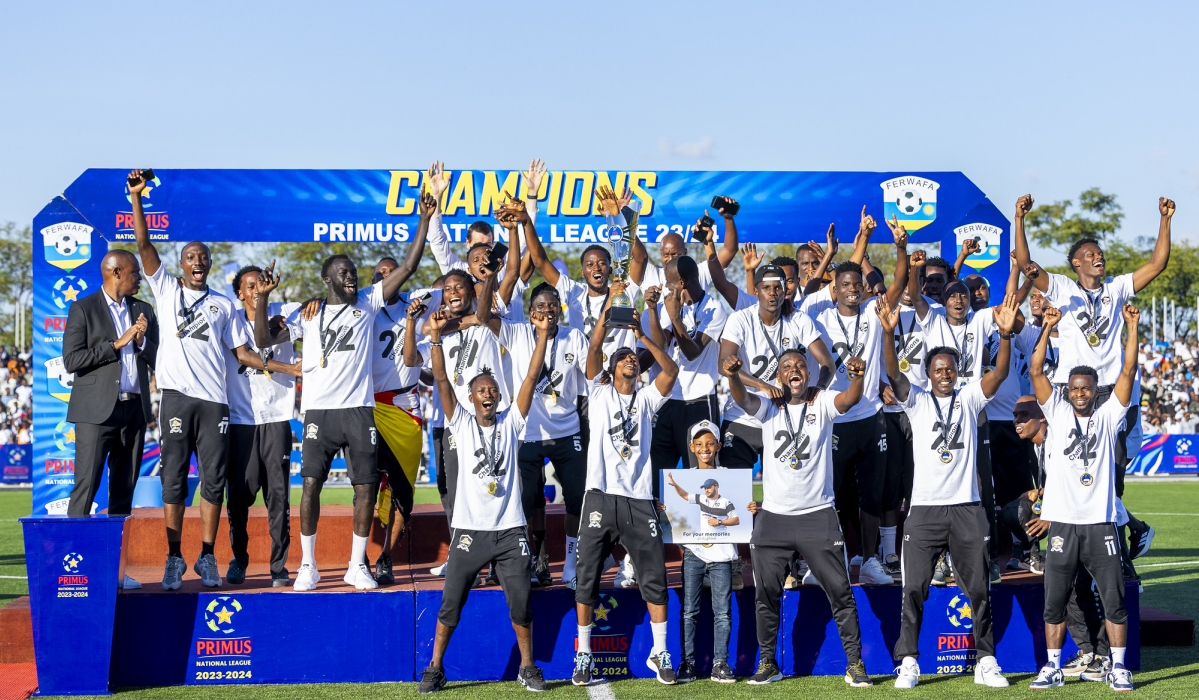 APR FC players and staff celebrate the 22nd national league title after playing a 1-1 draw against Amagaju FC at Kigali Pele stadium on May 12. APR won 19 games, drew 11 times and lost zero games. Mugwiza