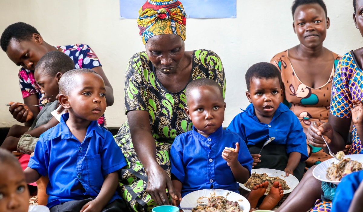 Parents with their children at an ECD centre in Kibimba village, Ngoma District. All photos by Craish Bahizi