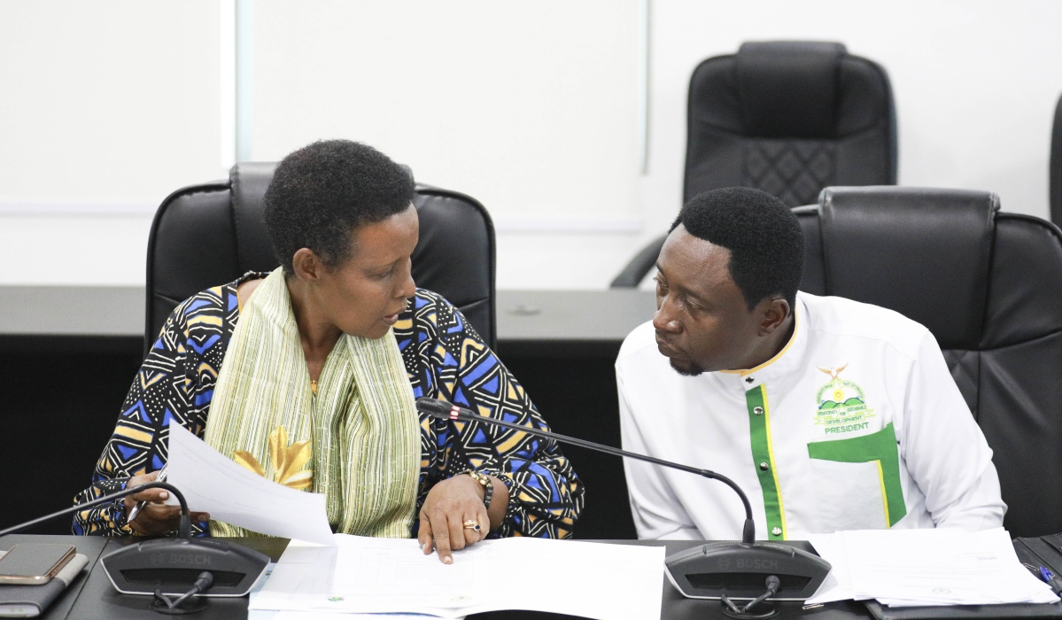 National Electoral Commission (NEC) Chairperson Oda Gasinzigwa interacts with Green Party President Frank Habineza while submitting his party&#039;s candidature in Kigali. Photo by Craish Bahizi