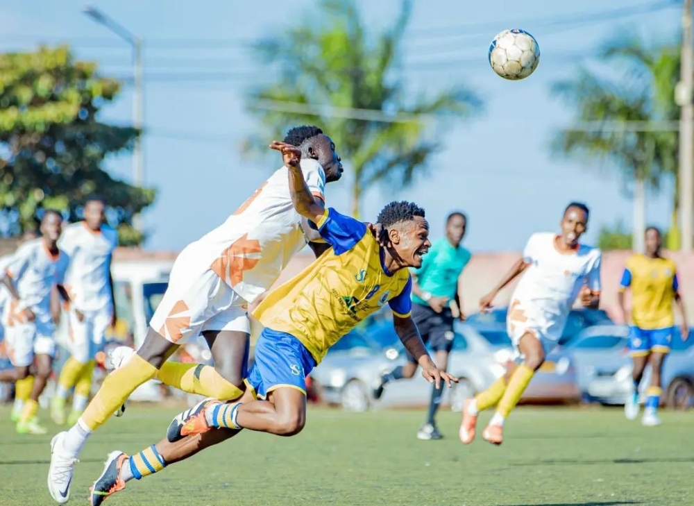 Vision FC and AS Muhanga vie for the ball during a 2-1 match at Mumena Stadium on Wednesday, May 22.  Photo by Frank Ngabo Traore.