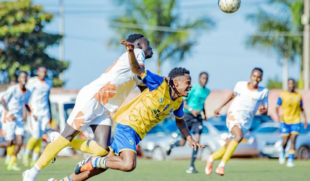 Vision FC and AS Muhanga vie for the ball during a 2-1 match at Mumena Stadium on Wednesday, May 22.  Photo by Frank Ngabo Traore.