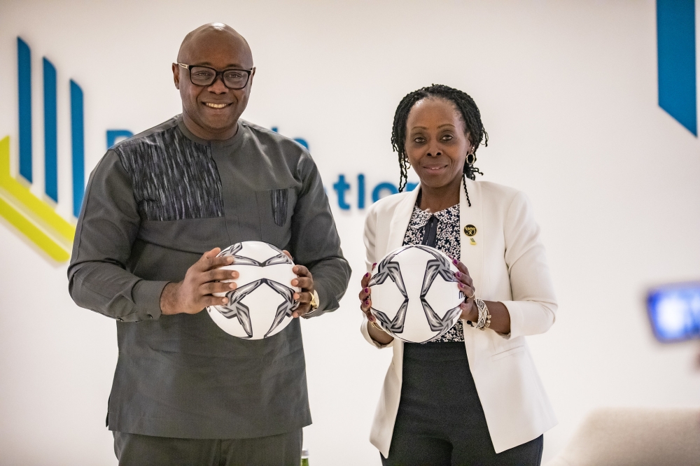 VCWC founder Fred Siewe and Christine Nkulikiyinka,the Chief Executive Officer of Rwanda Corporation Initiative as they launched  the new partnership in Kigali on May 22. Emmanuel Dushimimana
